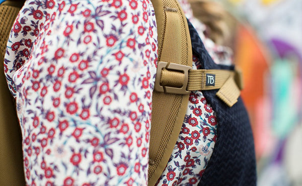 A close shot of a person wearing a Guide's Edition Synik 22 with the sternum strap buckled.